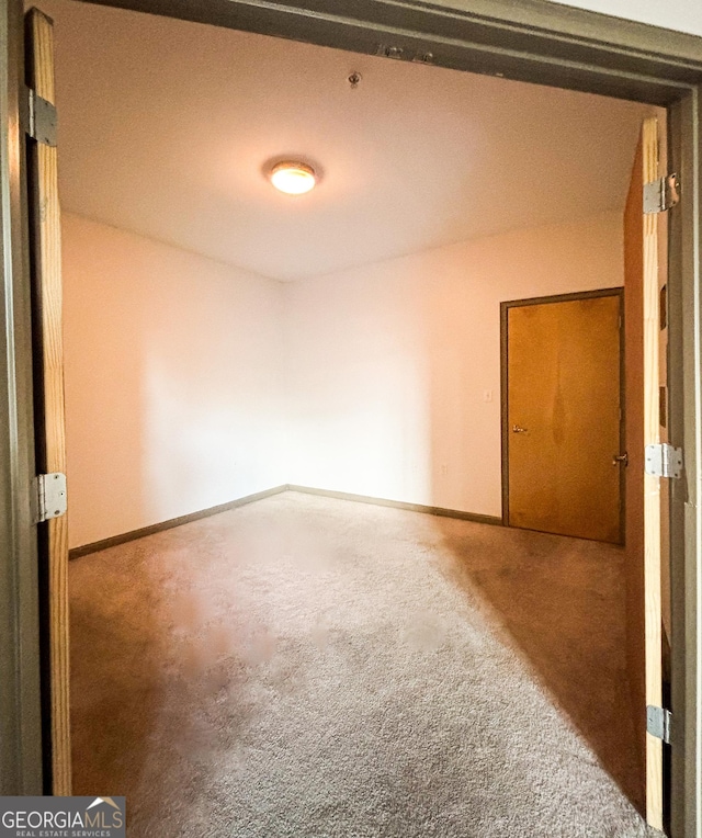 898 Oak St SW Unit 1215, Atlanta, GA 30310 - carpeted empty room featuring baseboards