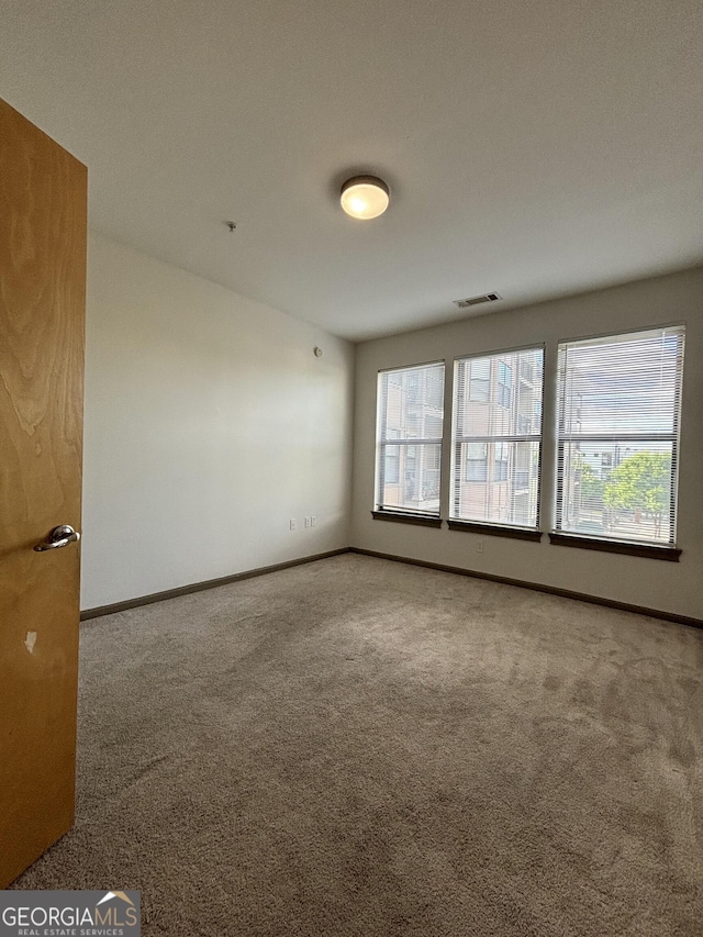 898 Oak St SW Unit 1215, Atlanta, GA 30310 - spare room with carpet flooring