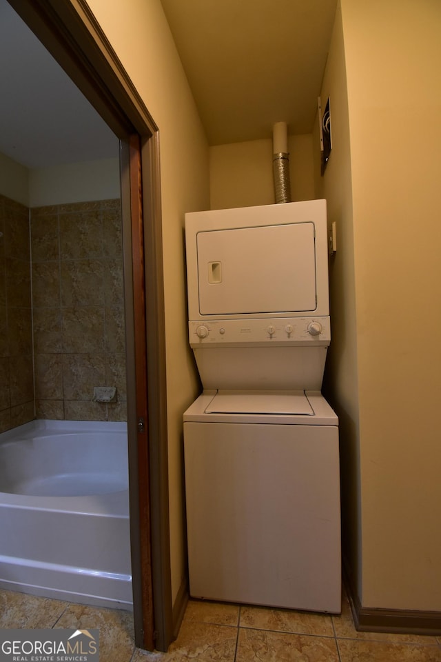 898 Oak St SW Unit 1215, Atlanta, GA 30310 - laundry room with stacked washer / dryer and light tile patterned floors