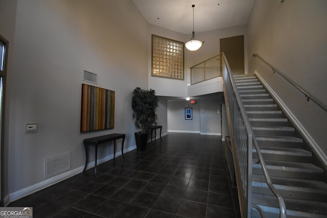 898 Oak St SW Unit 1215, Atlanta, GA 30310 - foyer with a towering ceiling, stairway, and tile patterned flooring