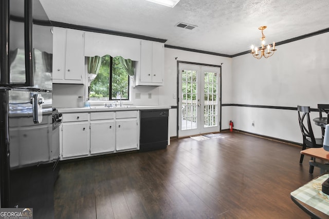 1271 Muirforest Ln, Stone Mountain, GA 30088 - kitchen featuring black dishwasher, light countertops, a textured ceiling, a chandelier, and freestanding refrigerator