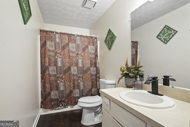 1271 Muirforest Ln, Stone Mountain, GA 30088 - full bathroom with vanity, wood finished floors, a textured ceiling, and curtained shower