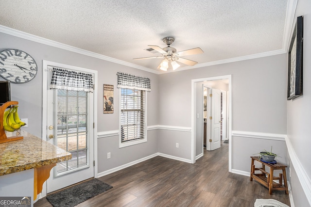 149 Crown Oaks Dr, Stockbridge, GA 30281 - dining room featuring dark wood finished floors, a textured ceiling, ornamental molding, and a ceiling fan