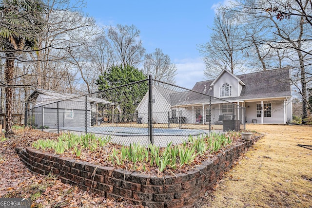 149 Crown Oaks Dr, Stockbridge, GA 30281 - rear view of property with a swimming pool and a shingled roof