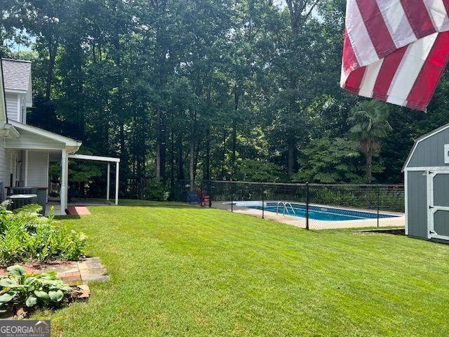 149 Crown Oaks Dr, Stockbridge, GA 30281 - view of yard with a storage shed