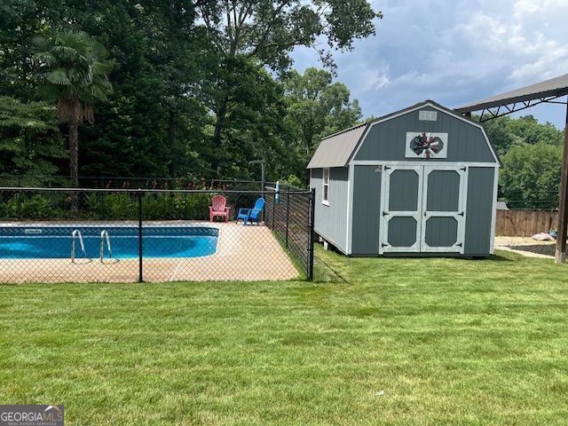 149 Crown Oaks Dr, Stockbridge, GA 30281 - view of pool with a shed