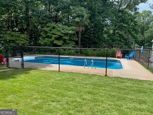 149 Crown Oaks Dr, Stockbridge, GA 30281 - view of swimming pool featuring view of scattered trees