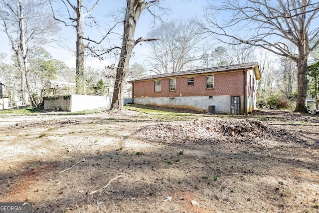 2522 Frost Dr SW, Marietta, GA 30008 - rear view of property featuring brick siding and crawl space