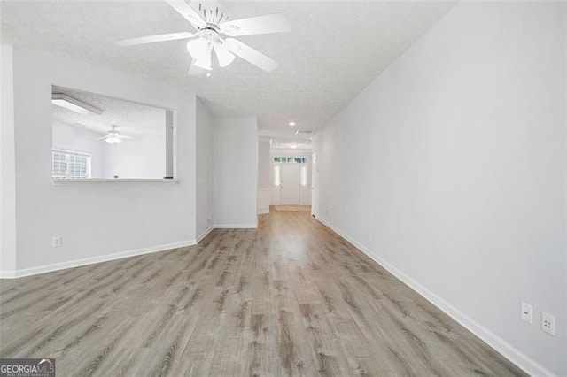13440 Avensong Xing, Alpharetta, GA 30004 - unfurnished room with a ceiling fan, a textured ceiling, and wood finished floors