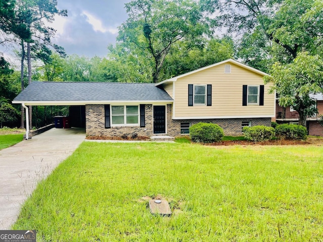 935 Mccall Rd, Macon, GA 31217 - split level home with a front yard, an attached carport, concrete driveway, and brick siding