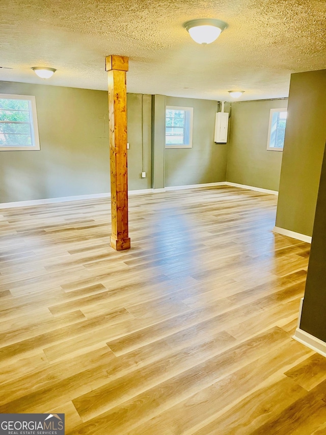 935 Mccall Rd, Macon, GA 31217 - below grade area featuring wood finished floors, plenty of natural light, and a textured ceiling