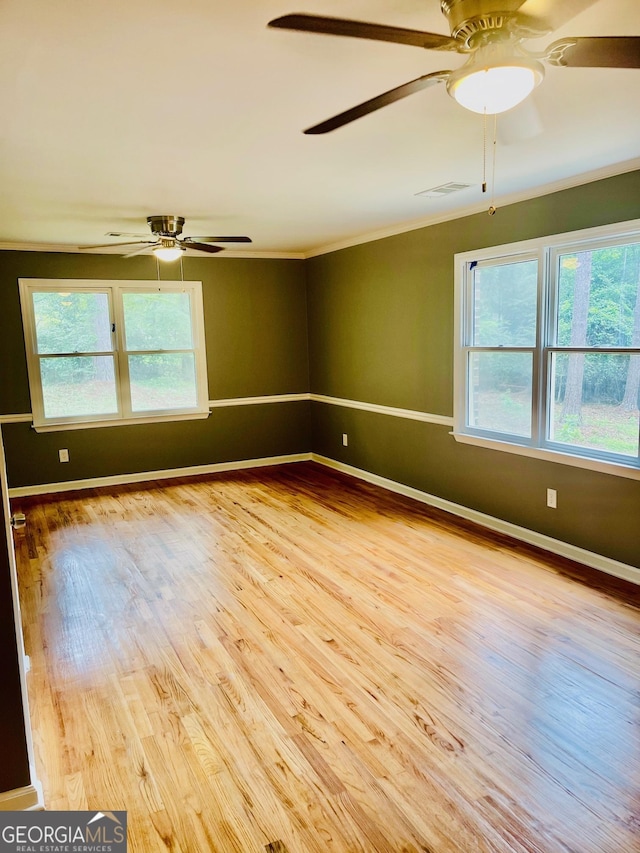 935 Mccall Rd, Macon, GA 31217 - unfurnished room with ceiling fan, wood finished floors, and ornamental molding