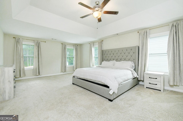 232 Shelton Cir, Temple, GA 30179 - carpeted bedroom featuring a tray ceiling and ceiling fan