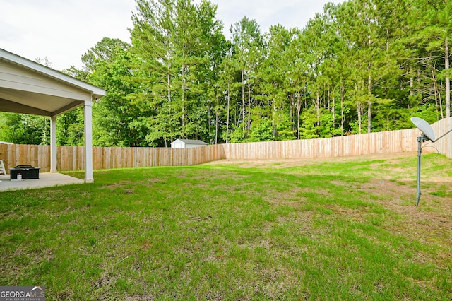 232 Shelton Cir, Temple, GA 30179 - fenced backyard with a patio area
