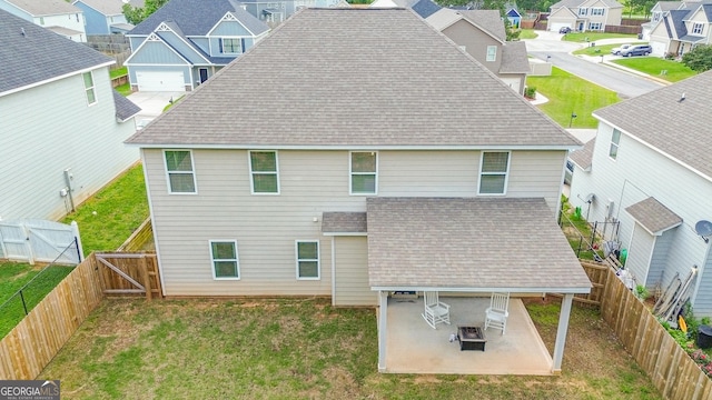 232 Shelton Cir, Temple, GA 30179 - rear view of house with a gate, a residential view, a shingled roof, a patio, and a fenced backyard