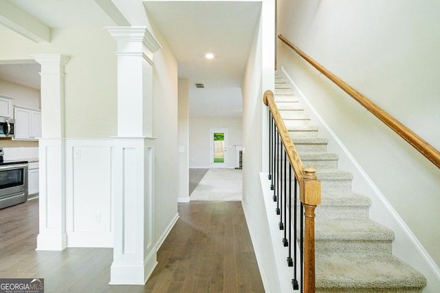 232 Shelton Cir, Temple, GA 30179 - stairs with decorative columns, wood finished floors, and recessed lighting