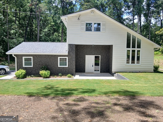 6985 Butner Rd, South Fulton, GA 30349 - view of front of home featuring stone siding and a front yard