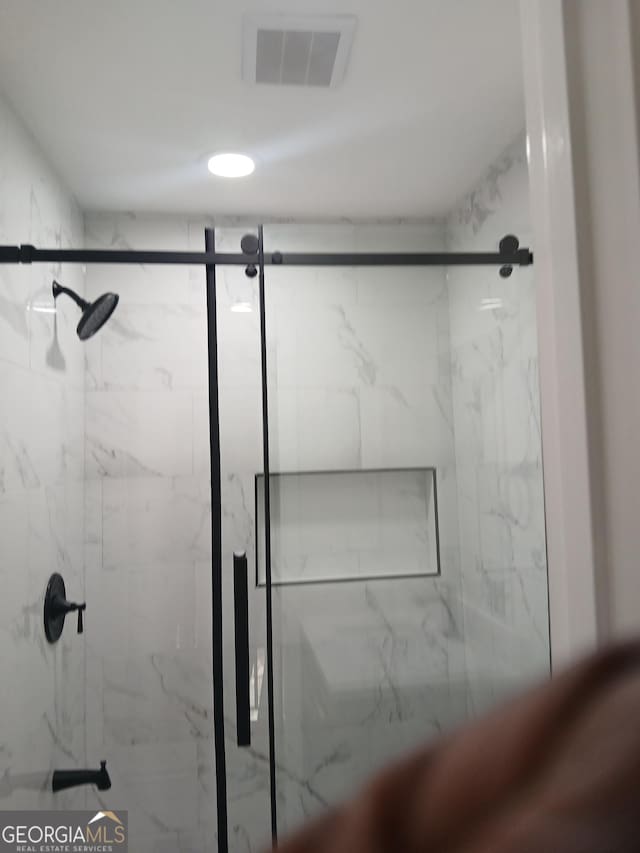 6985 Butner Rd, South Fulton, GA 30349 - bathroom featuring a marble finish shower