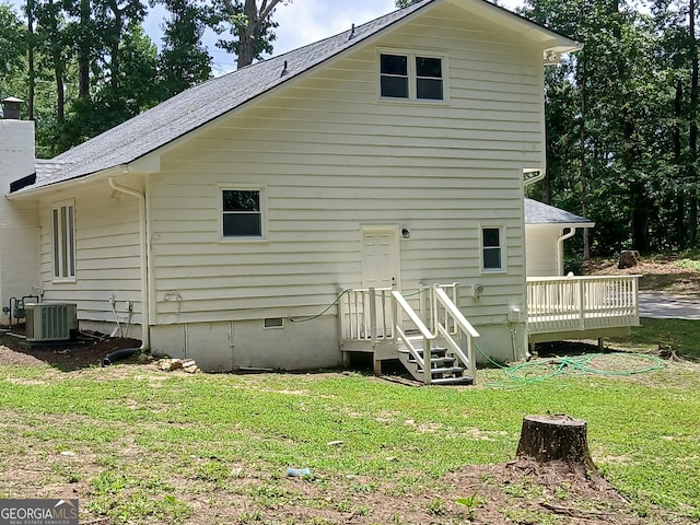 6985 Butner Rd, South Fulton, GA 30349 - rear view of property with a lawn, a wooden deck, roof with shingles, and a chimney