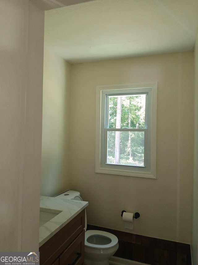 6985 Butner Rd, South Fulton, GA 30349 - bathroom with toilet and vanity
