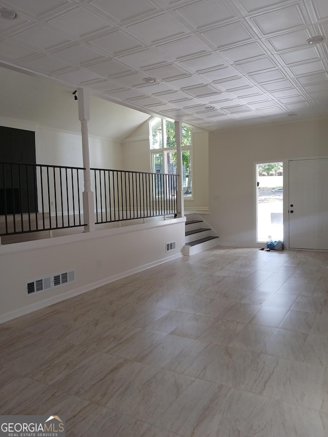 6985 Butner Rd, South Fulton, GA 30349 - spare room with lofted ceiling and an ornate ceiling