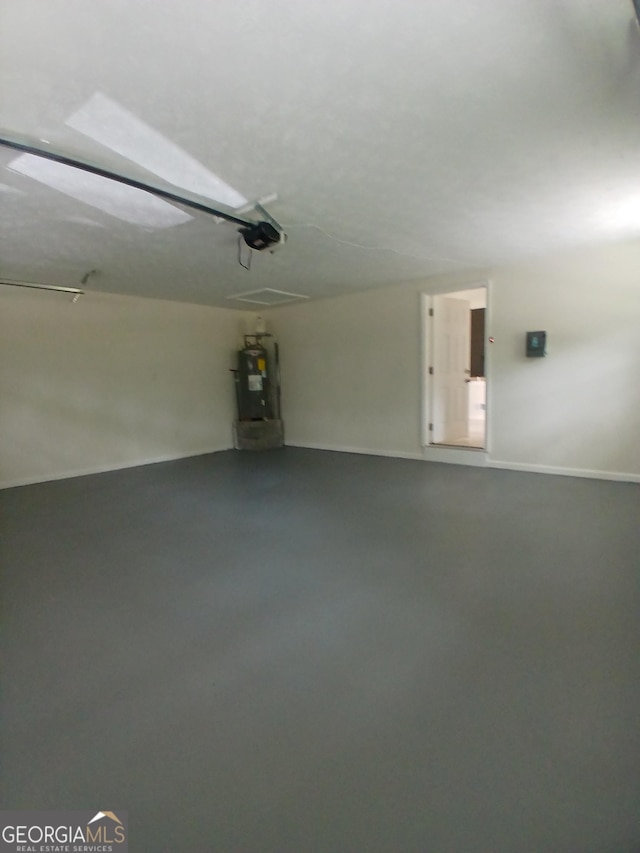 6985 Butner Rd, South Fulton, GA 30349 - garage featuring a garage door opener and electric water heater