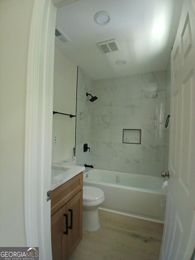 6985 Butner Rd, South Fulton, GA 30349 - bathroom featuring vanity, bathtub / shower combination, and wood finished floors