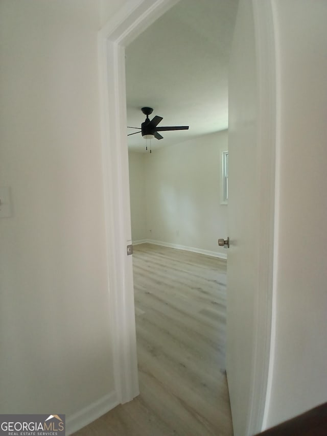 6985 Butner Rd, South Fulton, GA 30349 - corridor featuring baseboards and wood finished floors