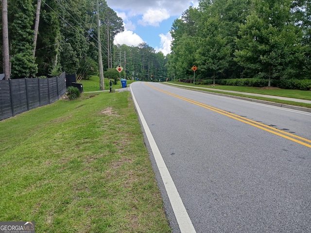 6985 Butner Rd, South Fulton, GA 30349 - view of asphalt street featuring traffic signs