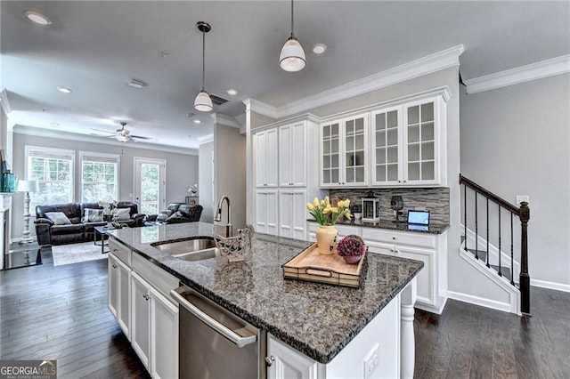 711 Topsail Ln, Alpharetta, GA 30005 - kitchen with stainless steel dishwasher, ornamental molding, white cabinets, dark wood-type flooring, and dark stone countertops