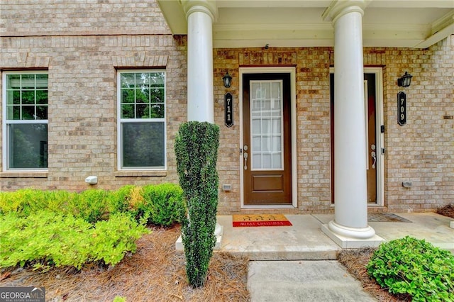 711 Topsail Ln, Alpharetta, GA 30005 - doorway to property featuring a porch and brick siding