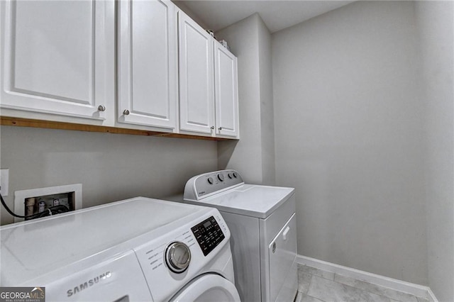 711 Topsail Ln, Alpharetta, GA 30005 - washroom with cabinet space, washing machine and dryer, and light tile patterned flooring