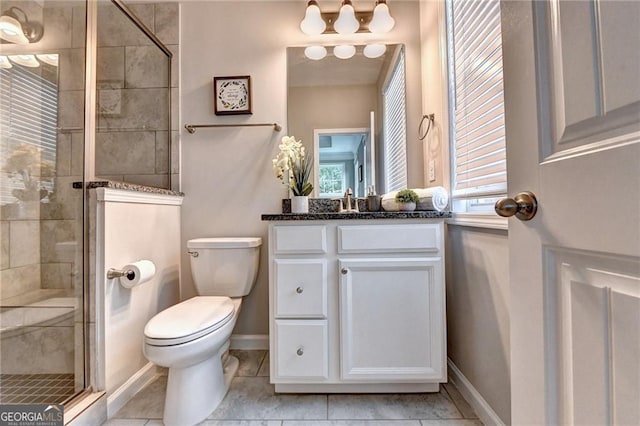 711 Topsail Ln, Alpharetta, GA 30005 - bathroom featuring vanity, a stall shower, healthy amount of natural light, and tile patterned floors