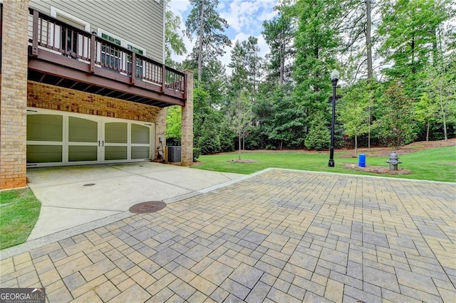 711 Topsail Ln, Alpharetta, GA 30005 - garage featuring driveway and view of scattered trees
