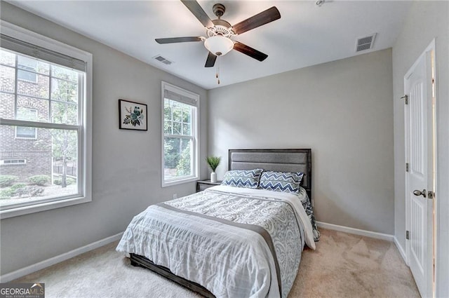 711 Topsail Ln, Alpharetta, GA 30005 - bedroom with light colored carpet and a ceiling fan