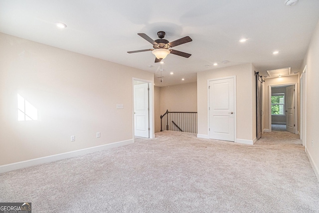 129 Academy Ln, Canton, GA 30114 - spare room with light carpet, recessed lighting, ceiling fan, attic access, and a smoke detector