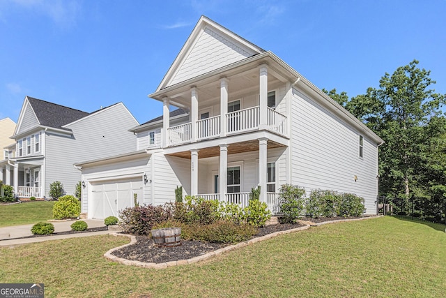 129 Academy Ln, Canton, GA 30114 - view of front of property with a balcony, covered porch, a garage, and a front yard