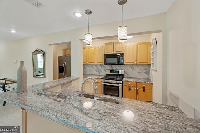 773 Van Briggle Path, Sugar Hill, GA 30518 - kitchen with appliances with stainless steel finishes, backsplash, light stone countertops, hanging light fixtures, and light brown cabinetry
