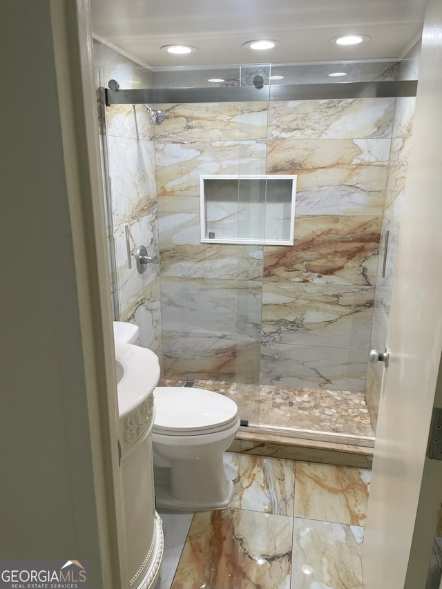 620 NE Peachtree St Unit 901, Atlanta, GA 30308 - bathroom with vanity, a marble finish shower, marble tiled floors, and recessed lighting