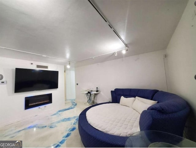 620 NE Peachtree St Unit 901, Atlanta, GA 30308 - living room featuring track lighting and a fireplace