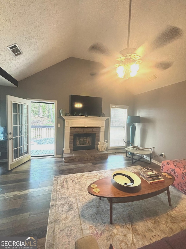 214 Sugar Hill Ct, Jackson, GA 30233 - living area featuring ceiling fan, healthy amount of natural light, wood finished floors, a textured ceiling, and vaulted ceiling