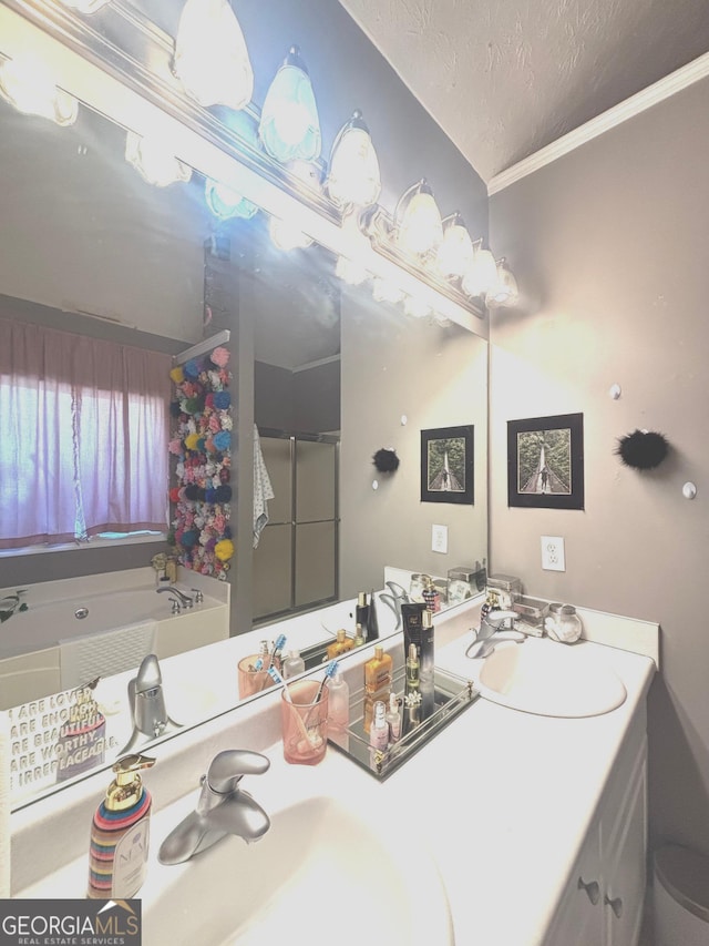 214 Sugar Hill Ct, Jackson, GA 30233 - full bathroom with double vanity, a garden tub, a textured ceiling, crown molding, and a shower