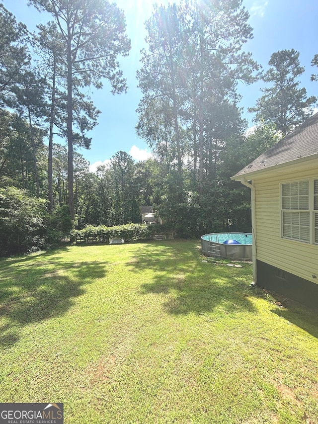 214 Sugar Hill Ct, Jackson, GA 30233 - view of green lawn featuring an outdoor pool