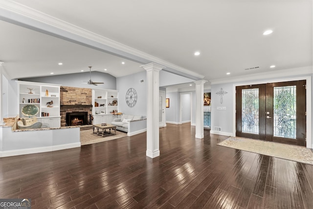 1572 Azalea Dr, Lawrenceville, GA 30043 - entrance foyer with vaulted ceiling, decorative columns, ceiling fan, a fireplace, and french doors
