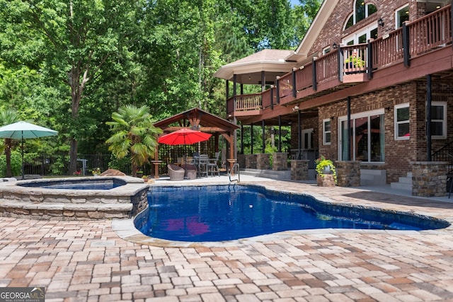 1572 Azalea Dr, Lawrenceville, GA 30043 - view of pool featuring a patio, a deck, a gazebo, and a pool with connected hot tub