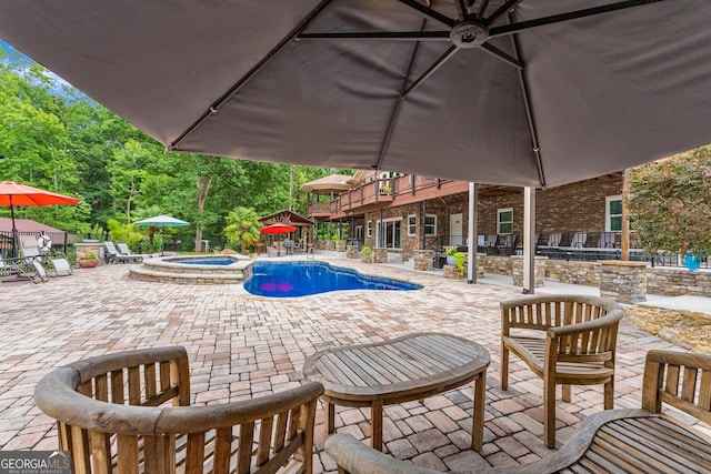 1572 Azalea Dr, Lawrenceville, GA 30043 - view of pool with a patio area and a pool with connected hot tub