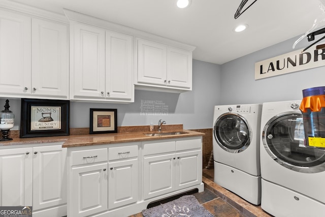 1572 Azalea Dr, Lawrenceville, GA 30043 - laundry area with cabinet space, washer and clothes dryer, recessed lighting, and dark stone finish floors