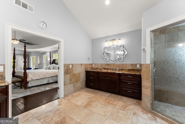 1572 Azalea Dr, Lawrenceville, GA 30043 - full bath featuring vanity, tile walls, a stall shower, connected bathroom, and tile patterned flooring