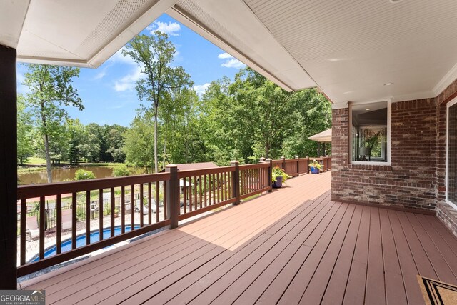 1572 Azalea Dr, Lawrenceville, GA 30043 - wooden deck featuring view of scattered trees and a water view