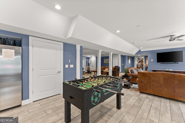 1572 Azalea Dr, Lawrenceville, GA 30043 - playroom featuring light wood finished floors, lofted ceiling, a ceiling fan, and recessed lighting